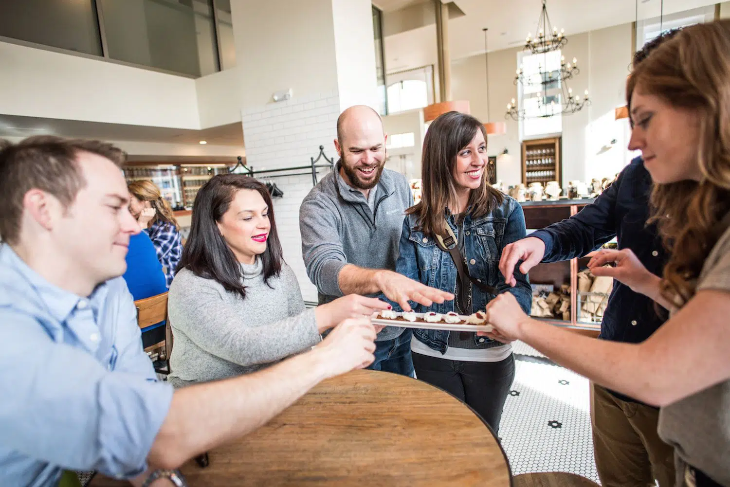 Guests enjoying a cheese taste on Denver food tour