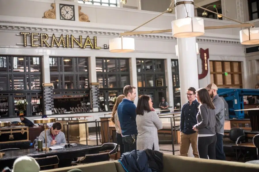 Group of people talking inside Denver's Union Station