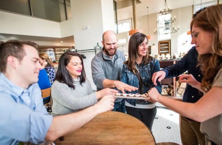 Guests enjoying a cheese taste on a Downtown Denver Food Tour