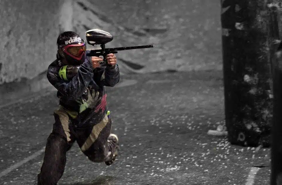 A paintballer running within American Paintball Coliseum, one of the most unique team outing ideas for Denver companies