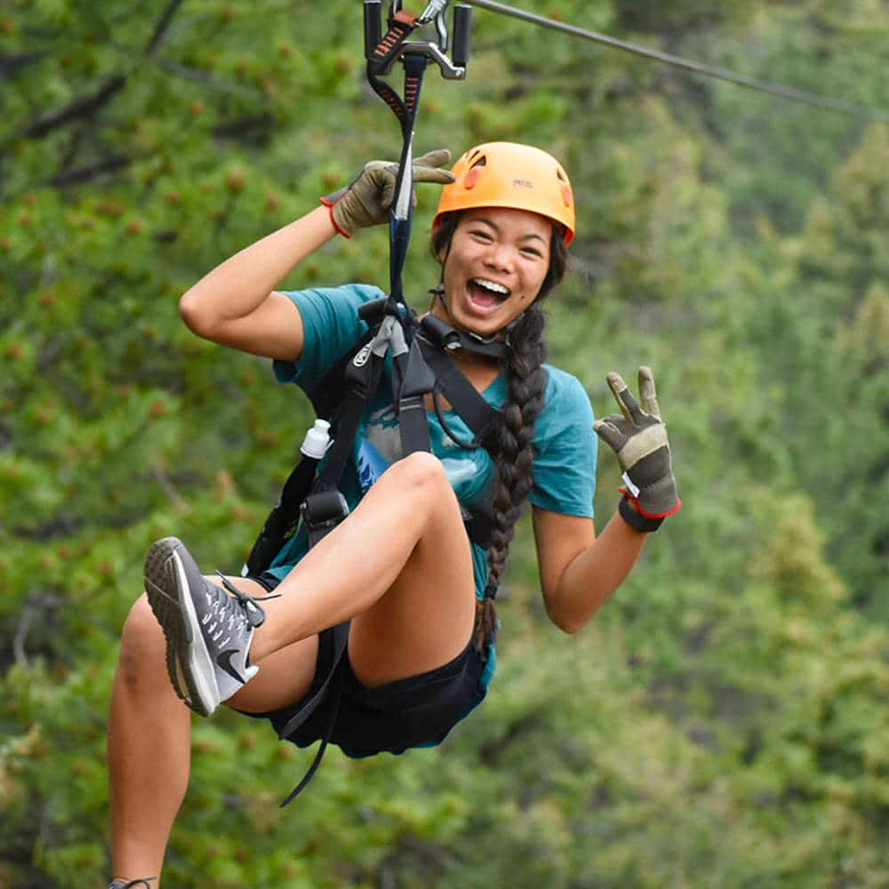 A woman experiencing Denver Zipline Tours