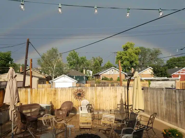 A double rainbow over the patio at Cana Wine Bar, which offers one of the best Denver happy hours for wine drinkers