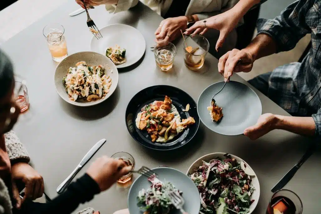 A group dining on shared plates at Dio Mio