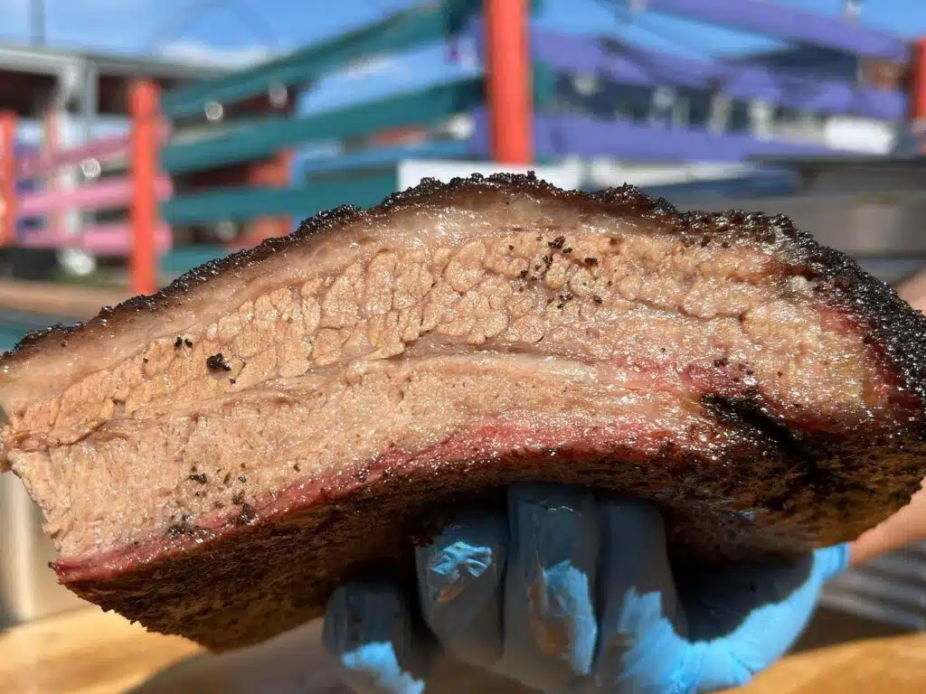 A massive piece of texas BBQ brisket from Pit Fiend Barbecue