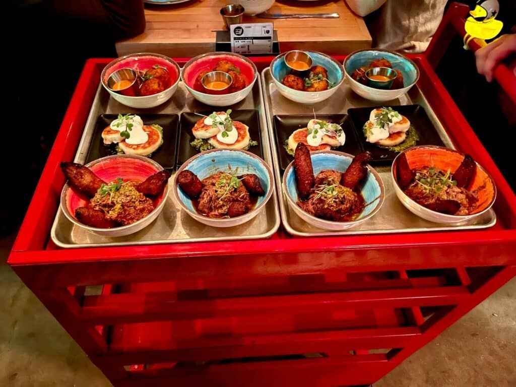 Latin American dishes on a dim sum-style cart, available at Super Mega Bien