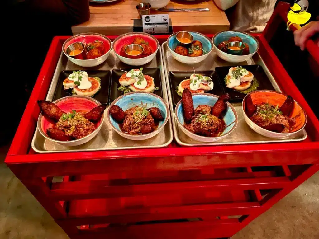 Latin American dishes on a dim sum-style cart, available at Super Mega Bien