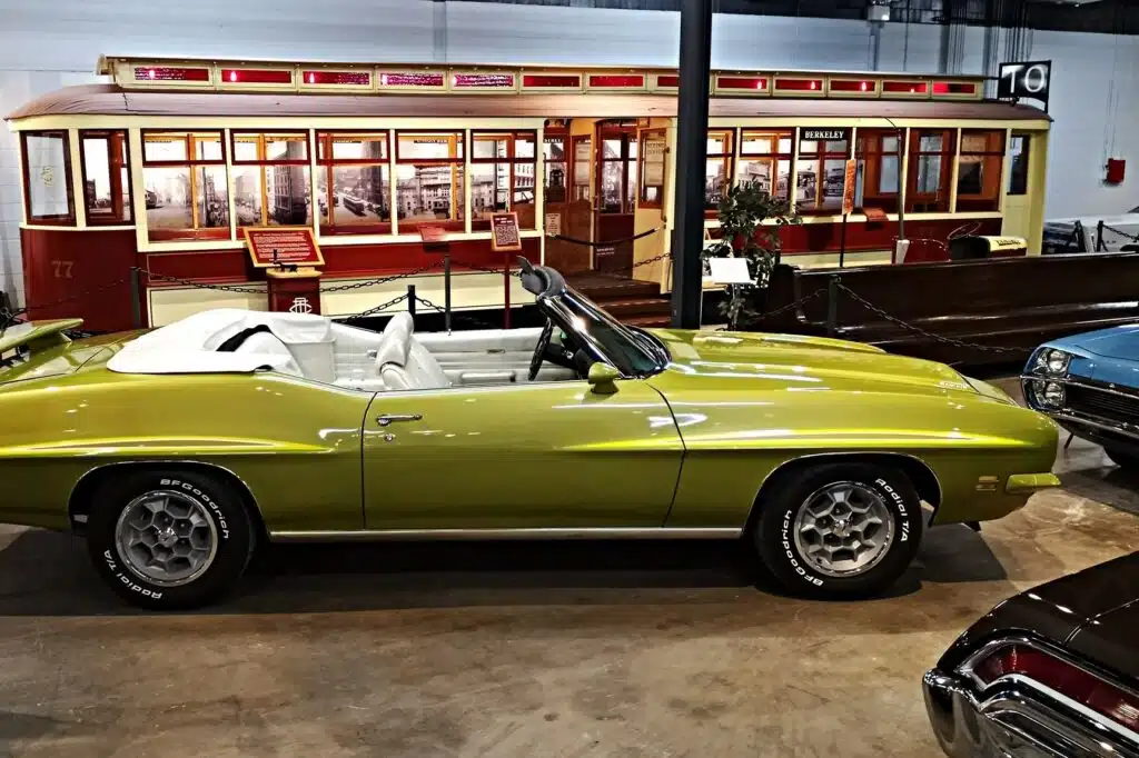 A vintage vehicle and antique trolley at the Forney Museum of Transportation, a unique RiNo activity