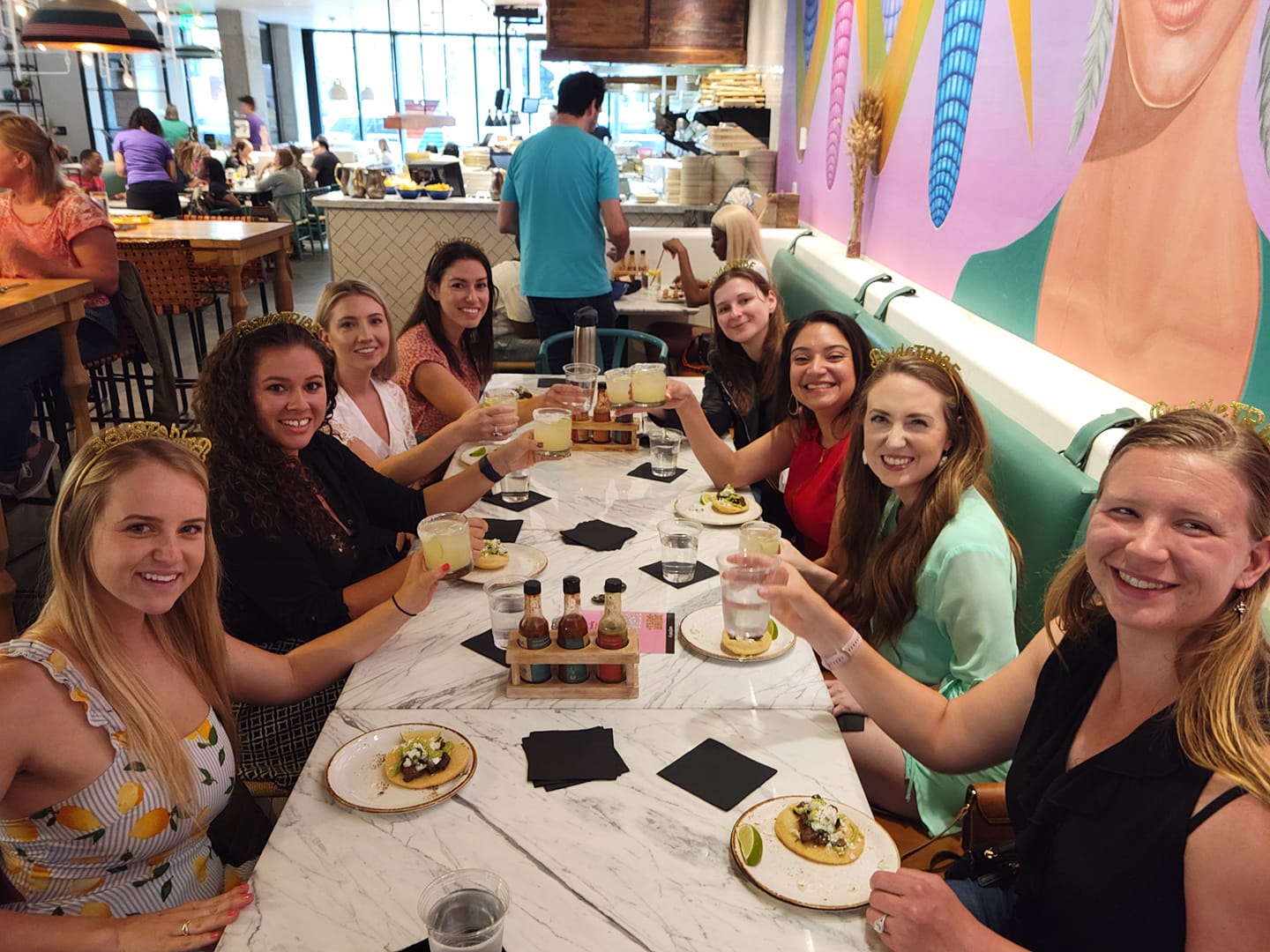 A bachelorette party toasting margaritas during a Downtown Denver Food Tour