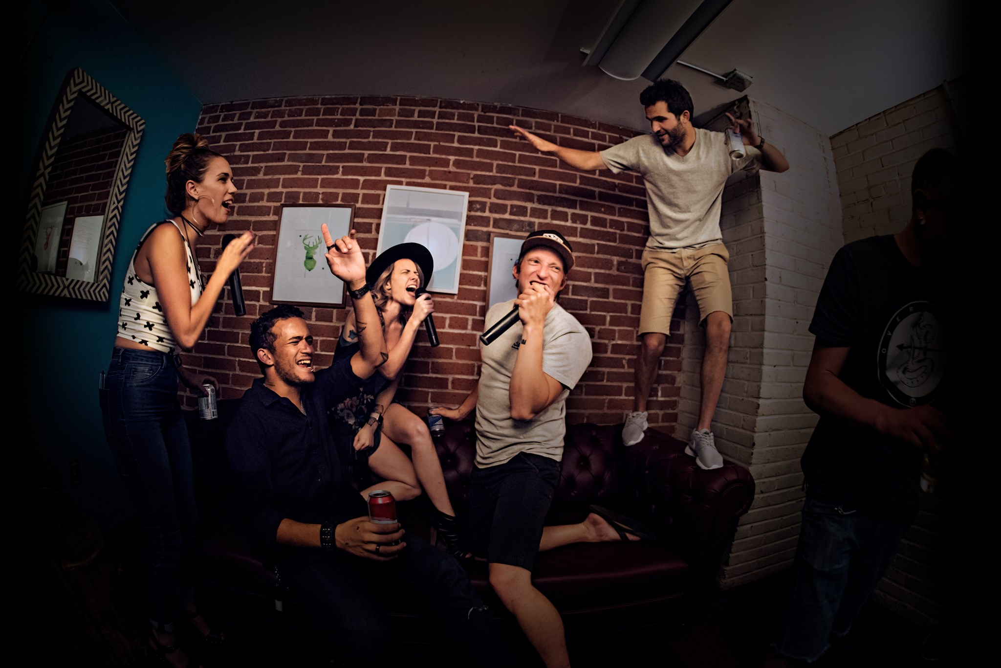 A group singing karaoke at Punch Bowl Social