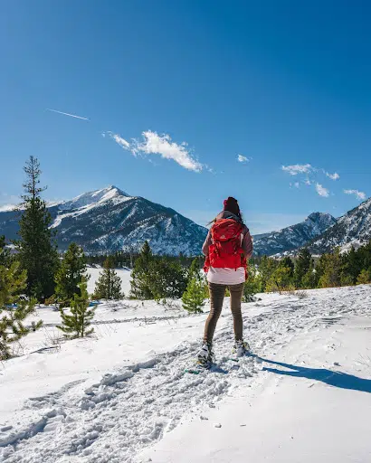 A woman snowshoeing in Colorado