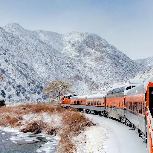 The Santa Express Train traveling through a snowy Royal Gorge