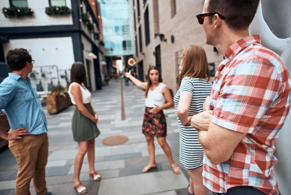 a food tour guide and group of guests in the dairy block alley in Denver Colorado