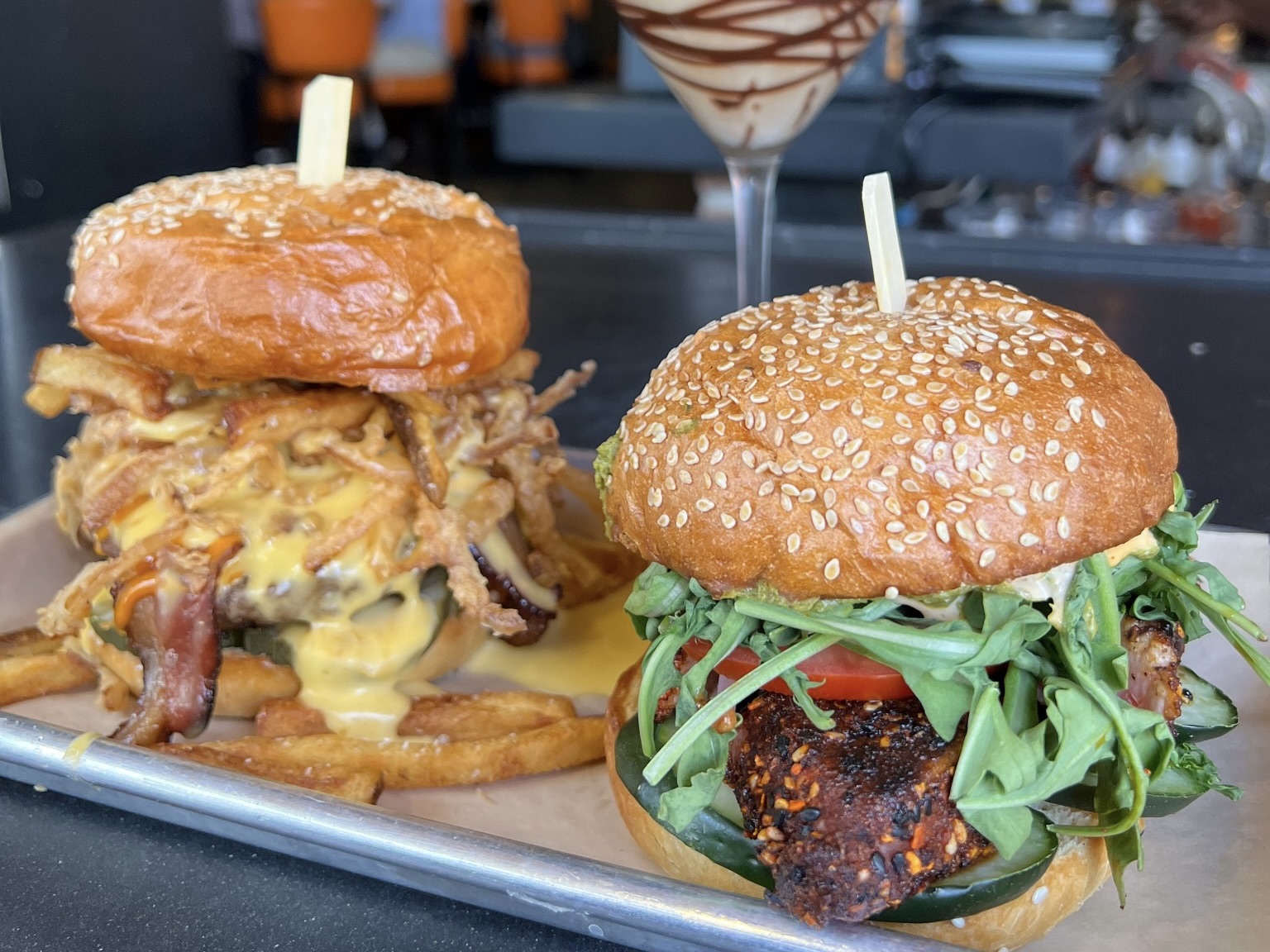 Two piled-high burgers from 5280 Burger Bar