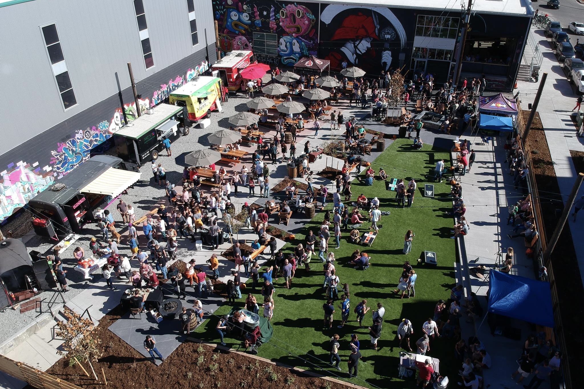 Food trucks and crowds gathered at Improper City's spacious patio