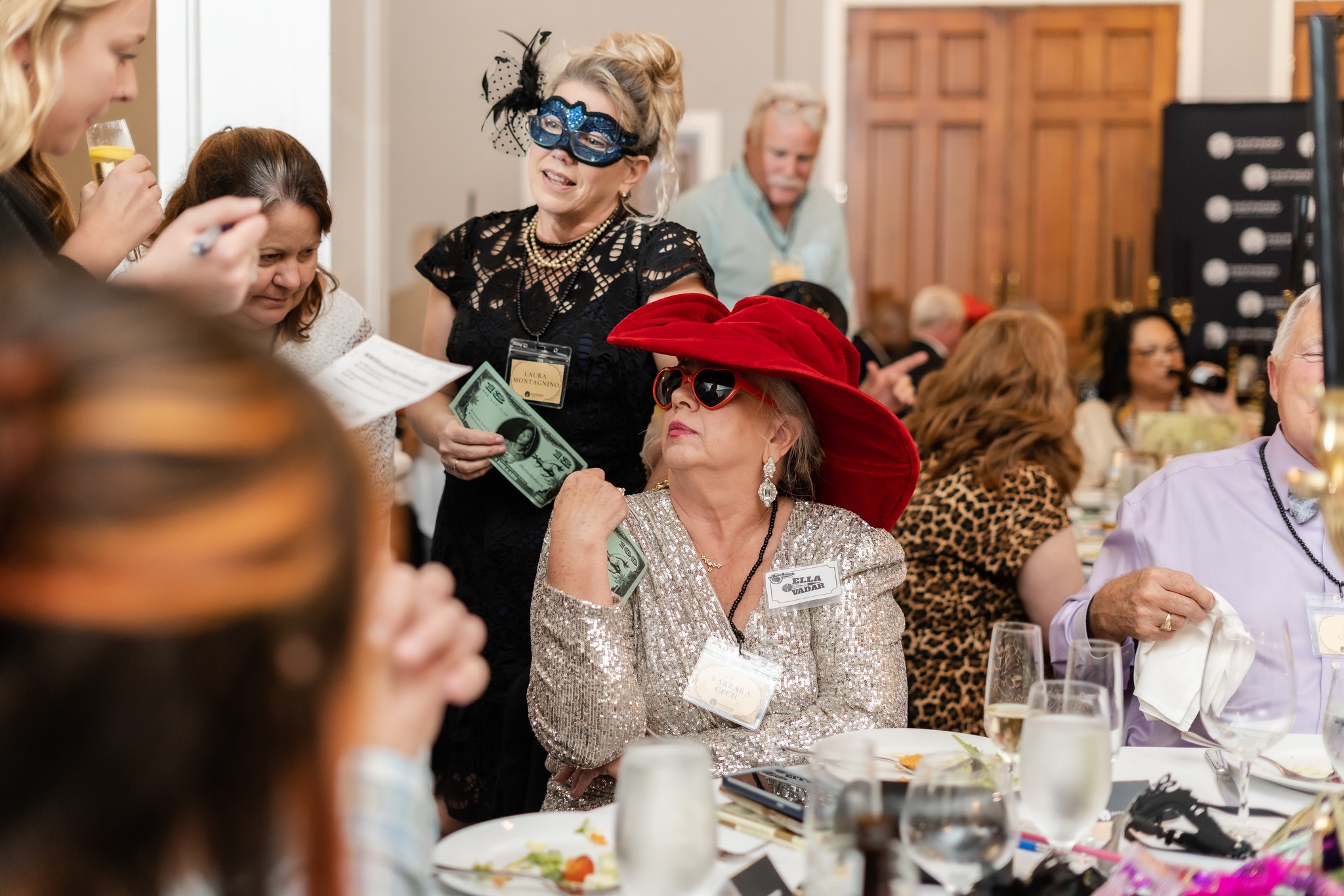 A woman in costume participating in a Murder Mystery Company event 