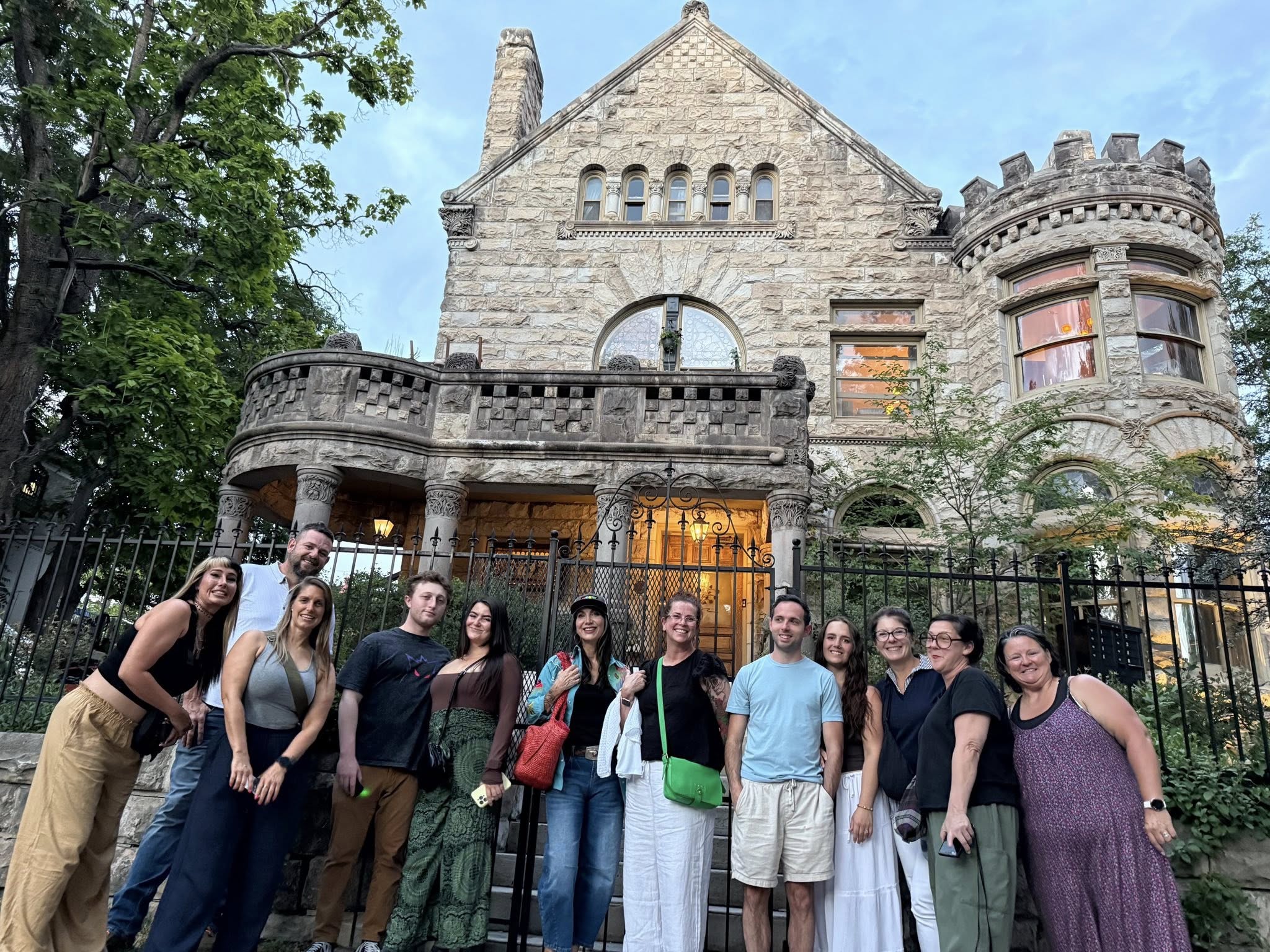 Ghost tour guests standing outside haunted mansion in Denver
