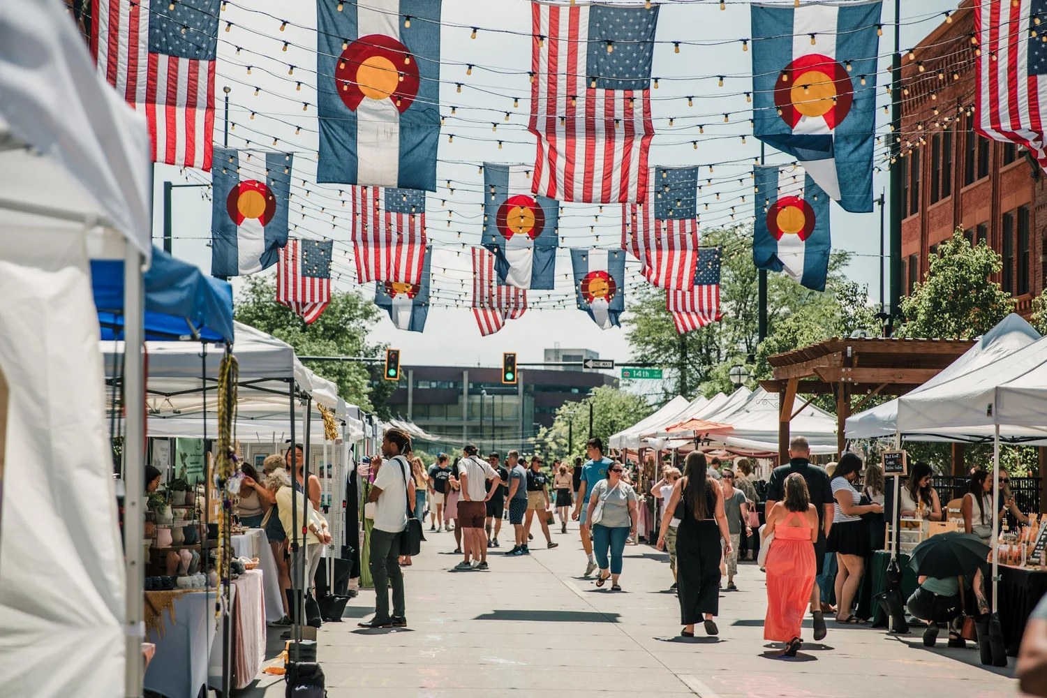people shopping at an outdoor market on larimer square denver