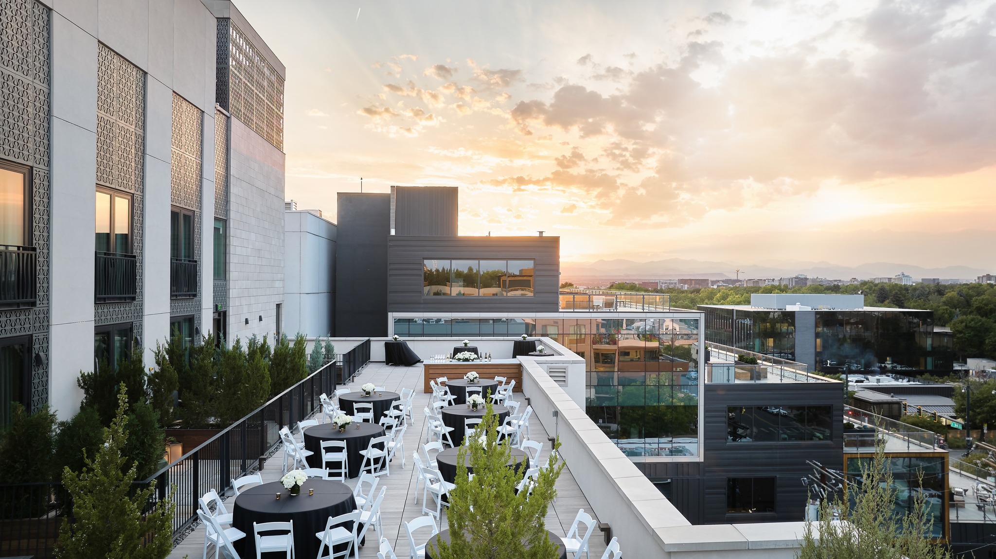 Banquet seating on the Halcyon's rooftop terrace which overlooks the Cherry Creek neighborhood 