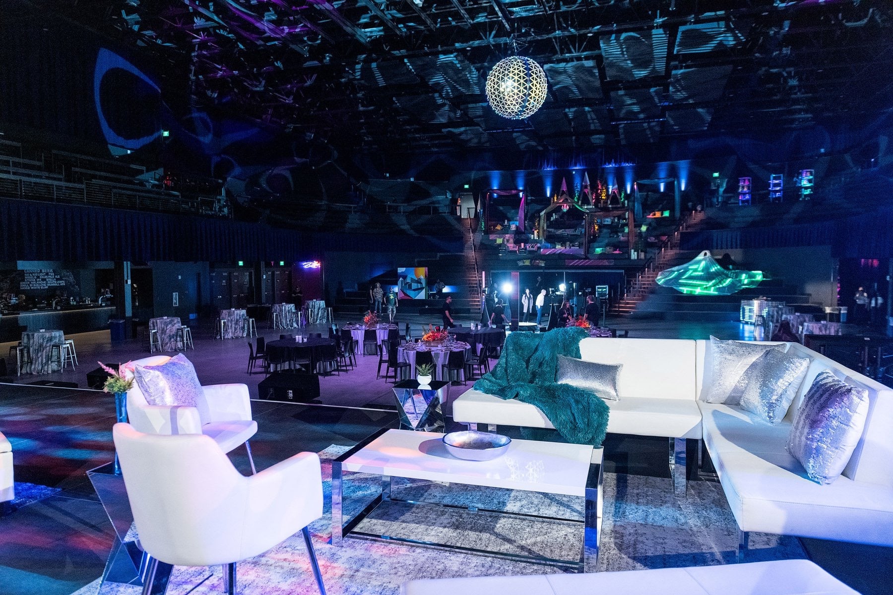 White leather seating, sparkly cushions and a disco ball within the dimly-lit Mission Ballroom