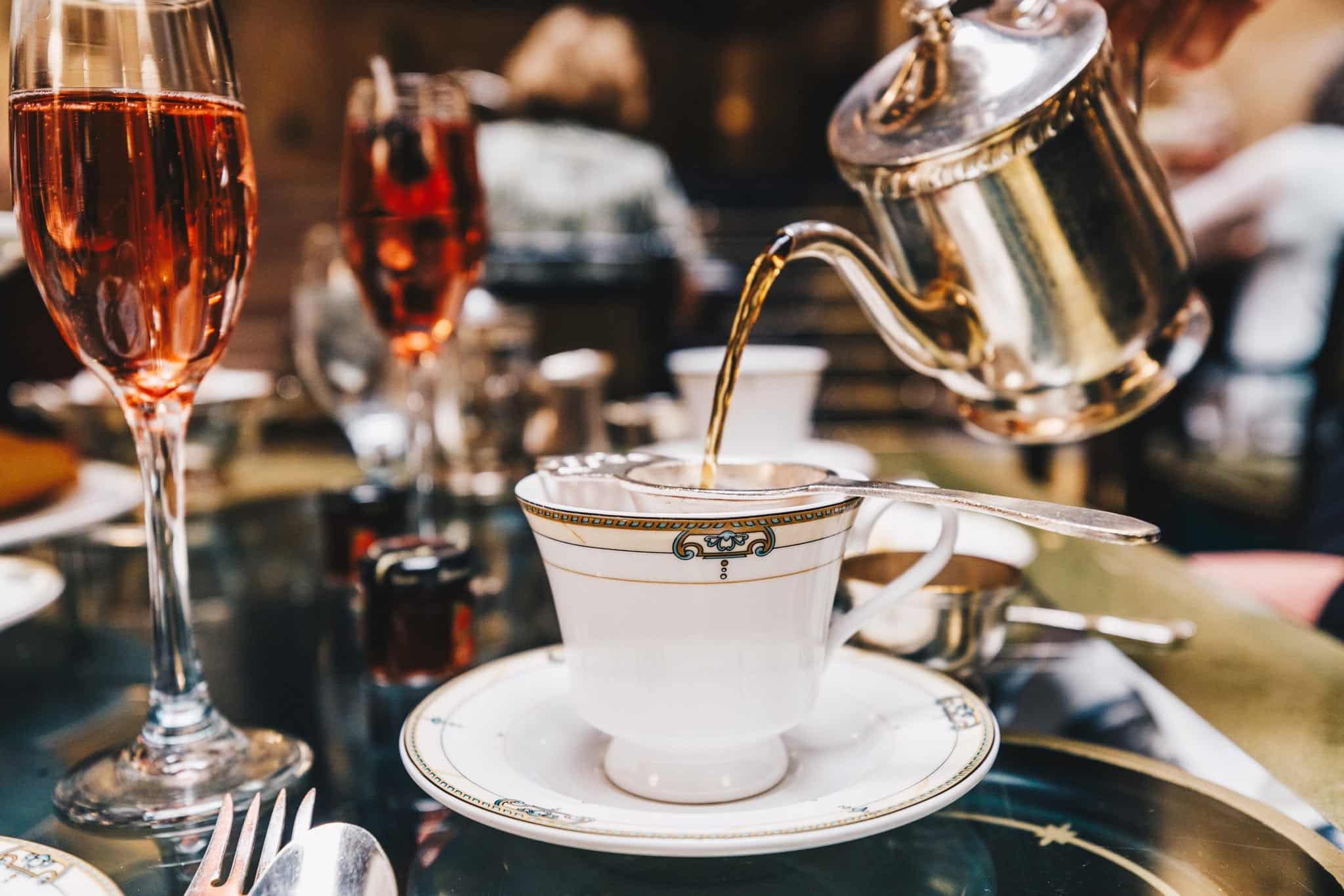 Tea being poured into a cup during afternoon tea at the Brown Palace Hotel