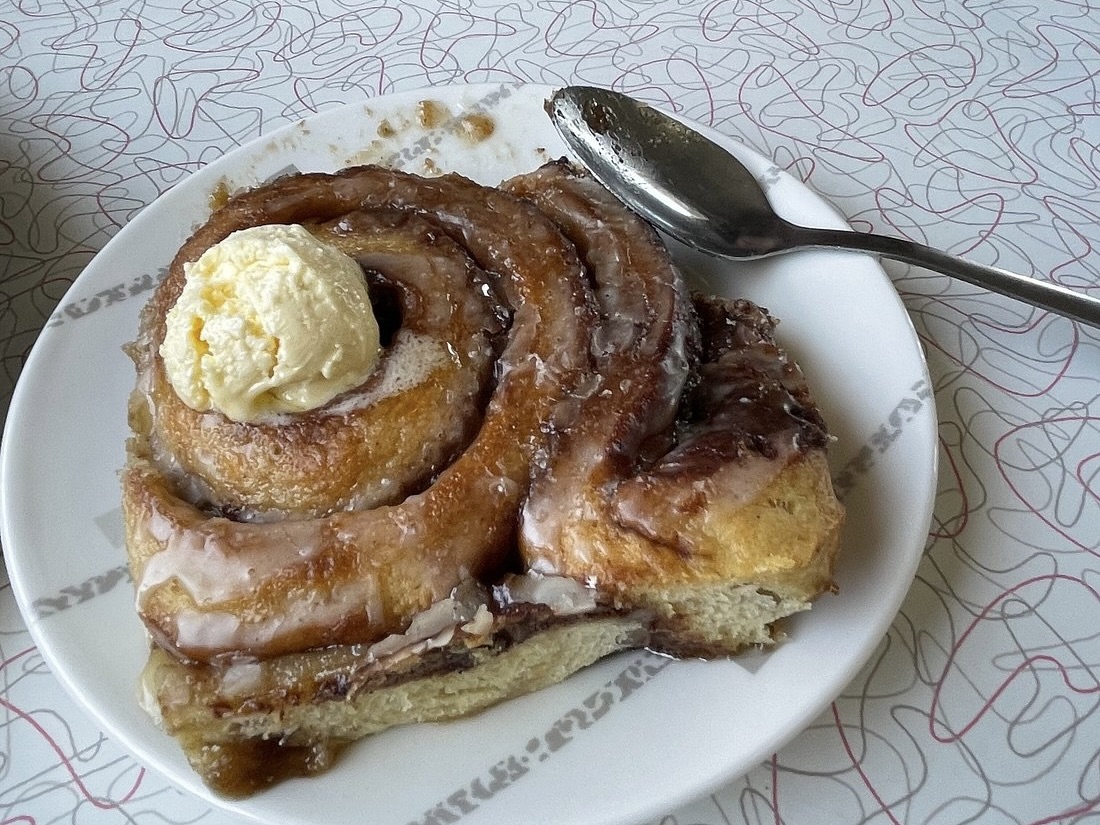 A cinnamon roll from Butcher Block Cafe, topped with a dab of butter