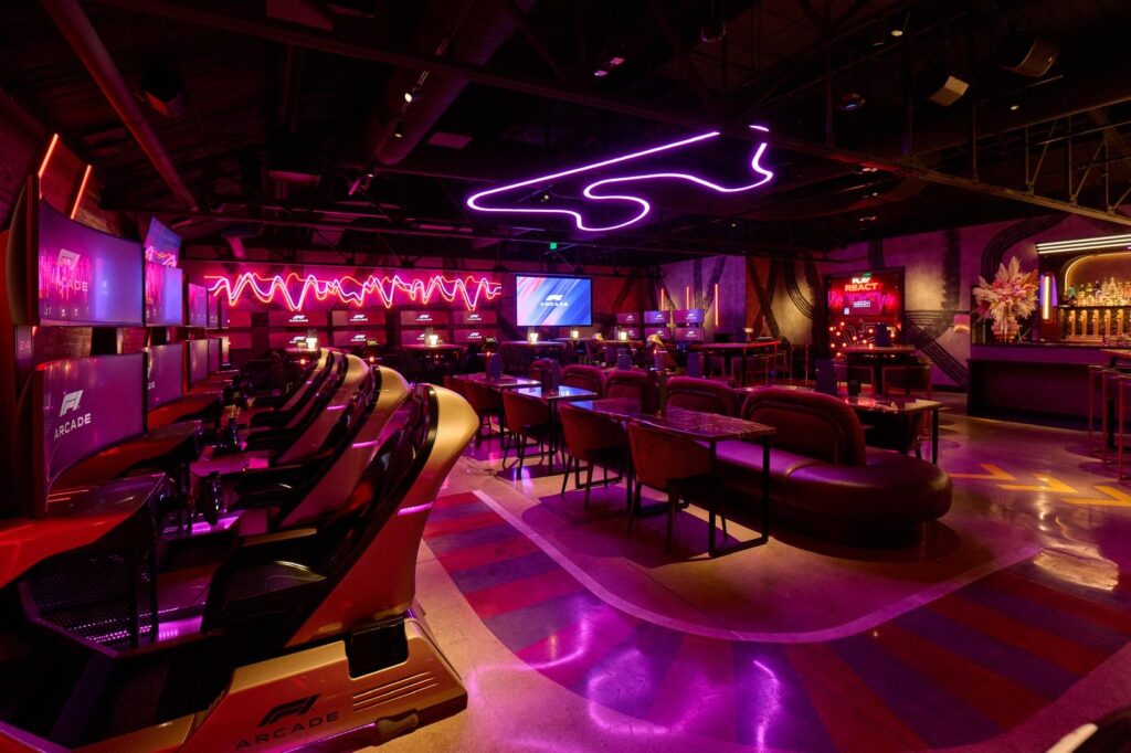 Neon lights and racing simulators inside F1 Arcade