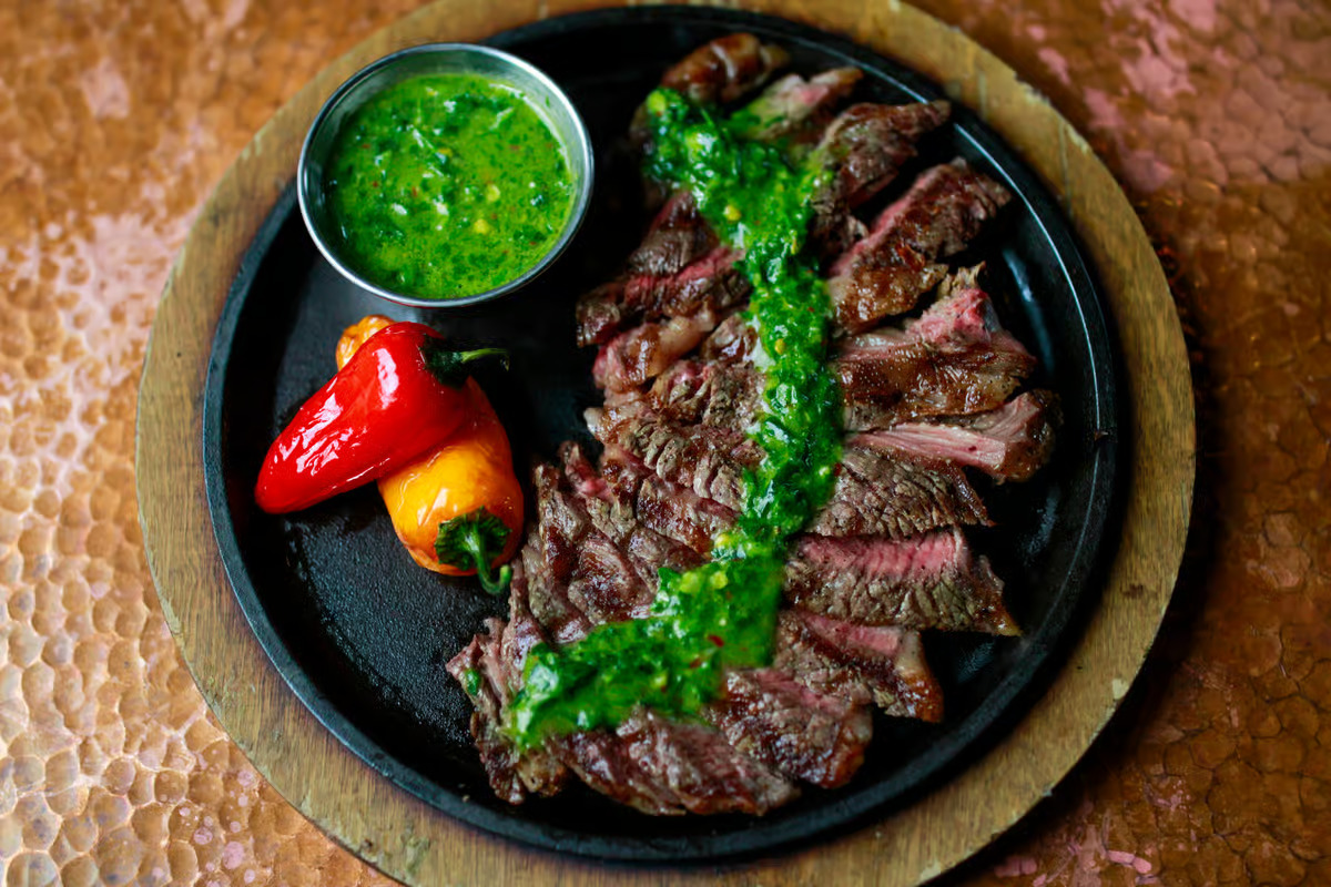 Chimichurri atop the vaquero ribeye from La Loma