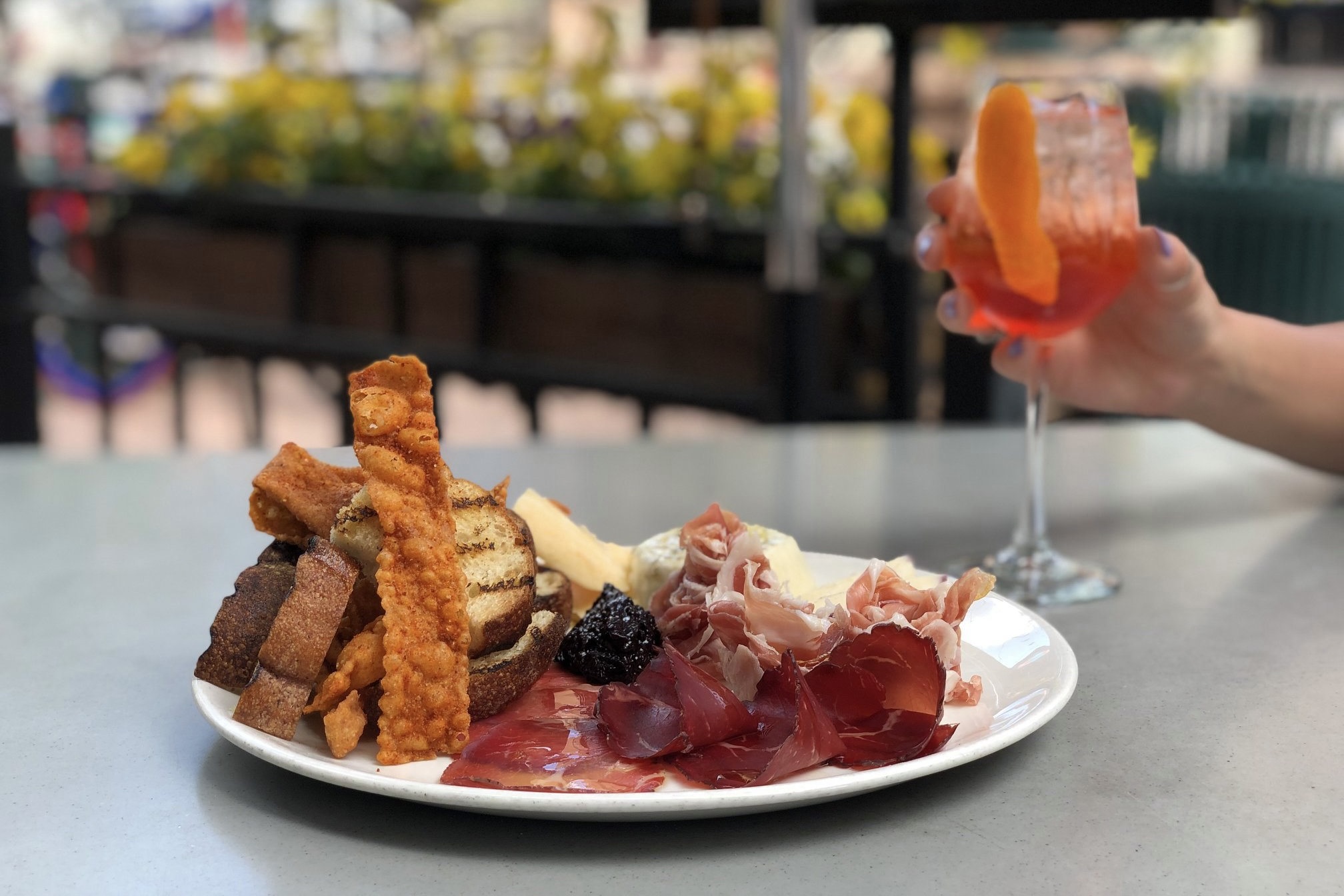 Charcuterie and a spritz on the Osteria Marco patio