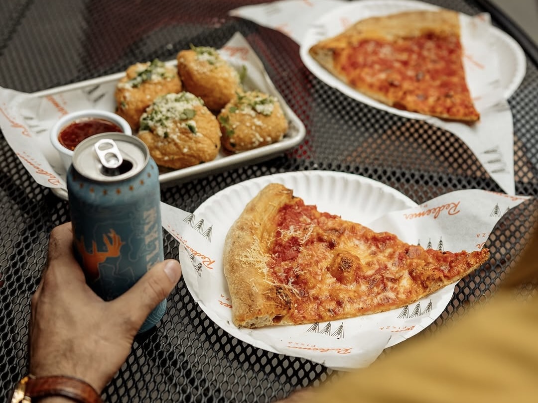 Garlic bread and slices of Redeemer pizza