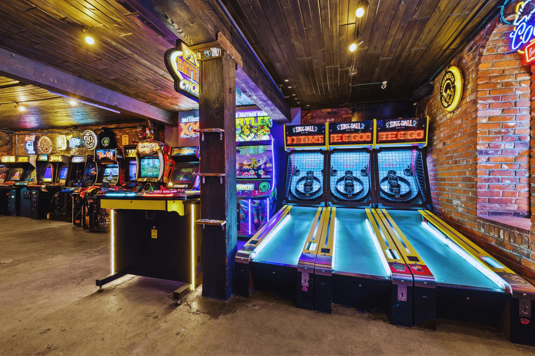 Skee-Ball machines, PacMan and a range of arcade games inside 1up Arcade Bar in LoDo