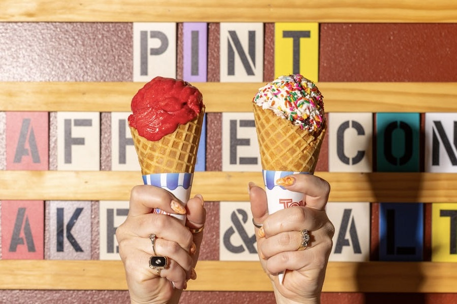 Hands holding up two ice cream cones from Cornicello