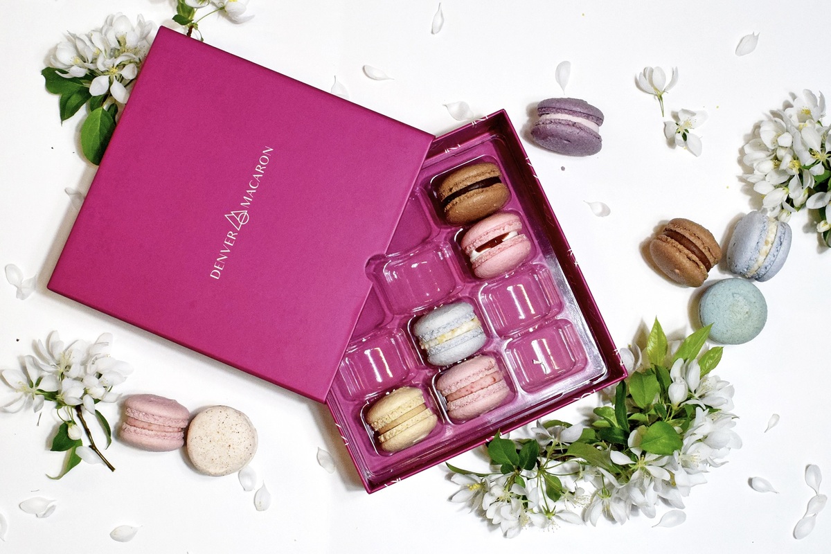 A pink-hued gift box of cookies from Denver Macaron