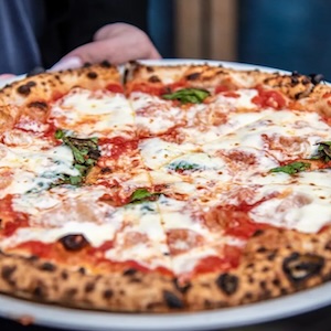Campagna pizza at Marco's Coal Fired Pizzeria on downtown food tour with delicious denver food tours