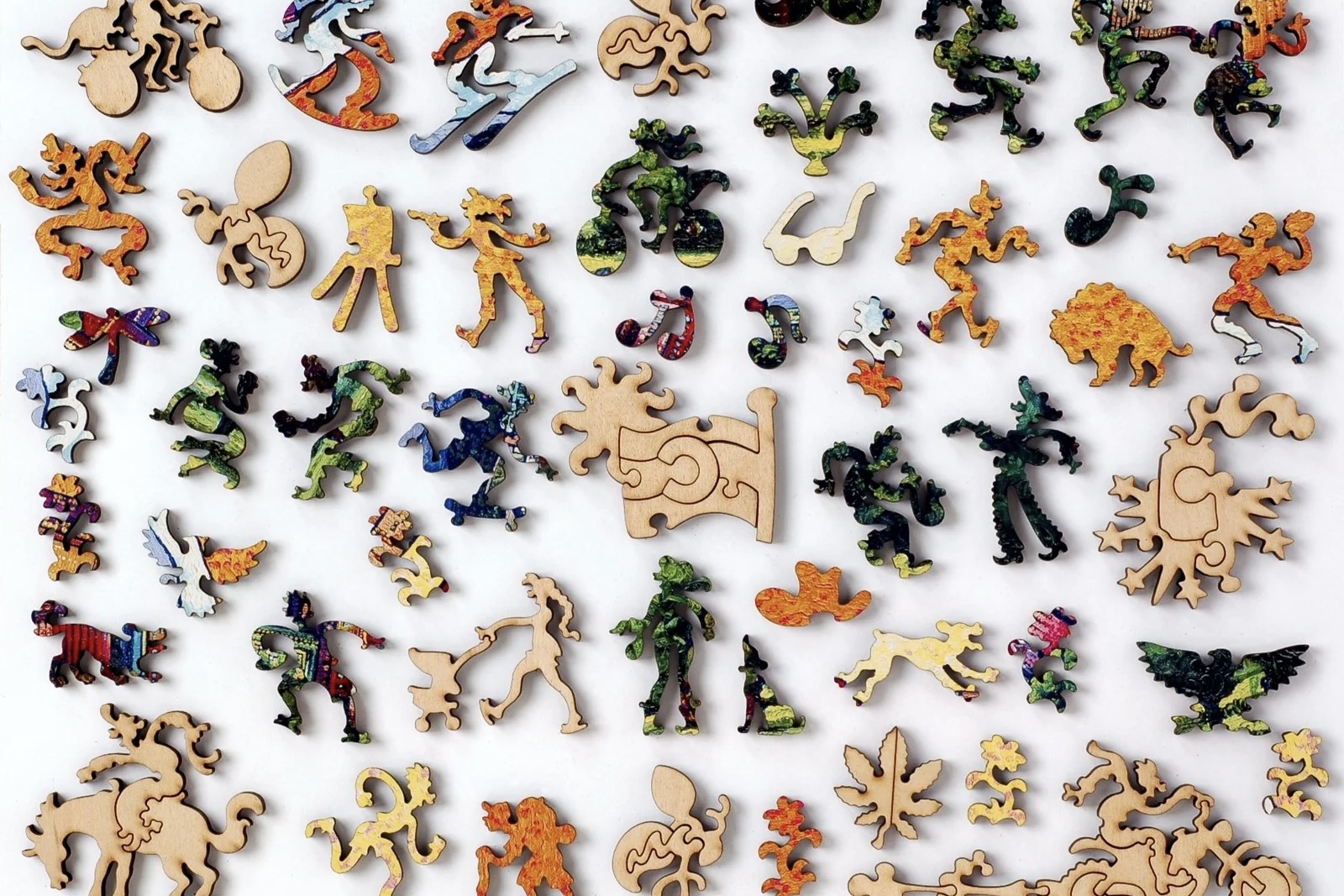 Wooden puzzle pieces of whimsical shapes from Liberty Puzzles